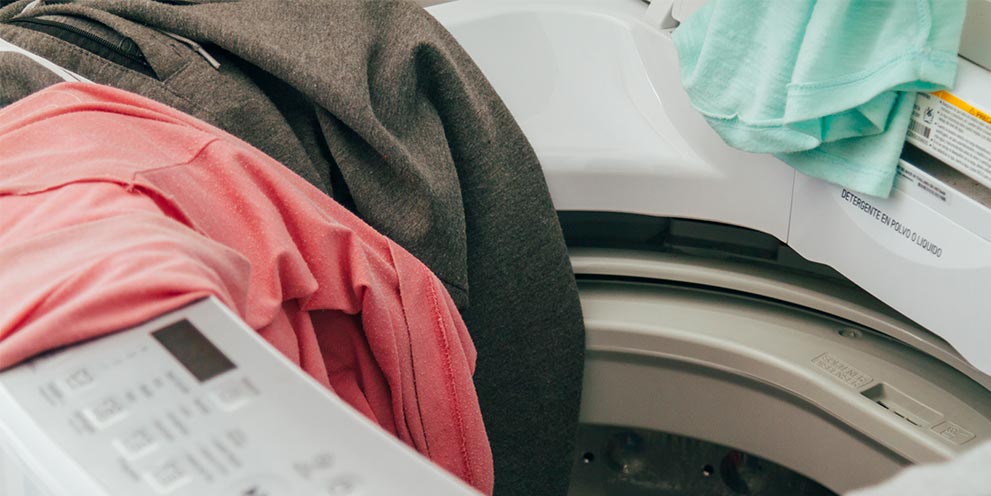 Clothes thrown around on washing machine